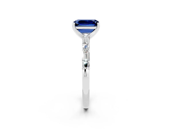 Silver Emerald Cut Blue Sapphire Solitaire with Side Baguettes and Channel Set Band