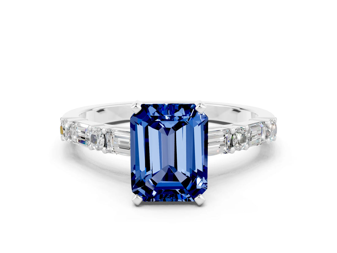 White gold Emerald Cut Blue Sapphire Solitaire with Side Baguettes and Channel Set Band