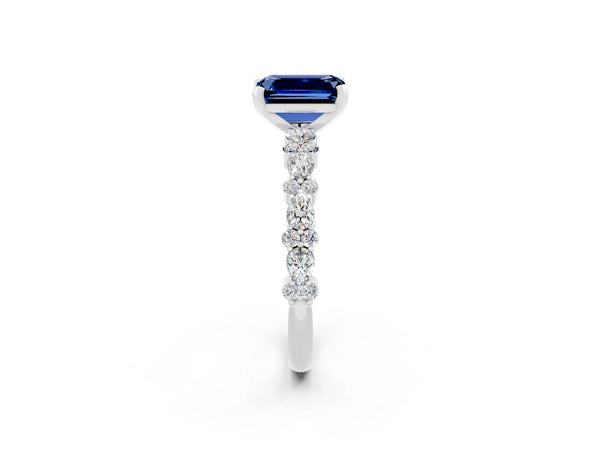 Silver Emerald Cut Blue Sapphire Side Stone Solitaire Ring with Round  and Four-Prong Setting