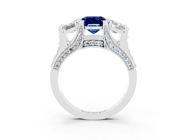 Silver Emerald Cut Blue Sapphire Three-Stone Ring with Channel Set Band and Four-Prong Setting