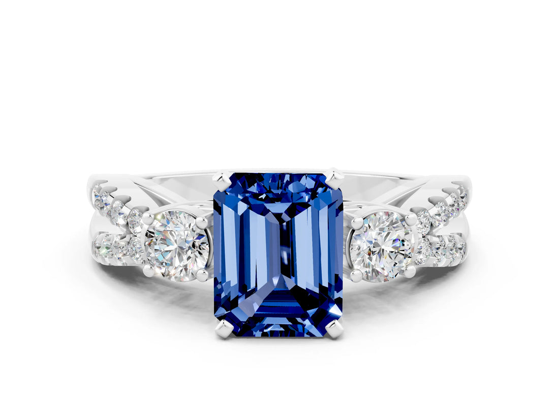 White gold Emerald Cut Blue Sapphire Three-Stone Ring with Pavé Split Shank and Four-Prong Setting