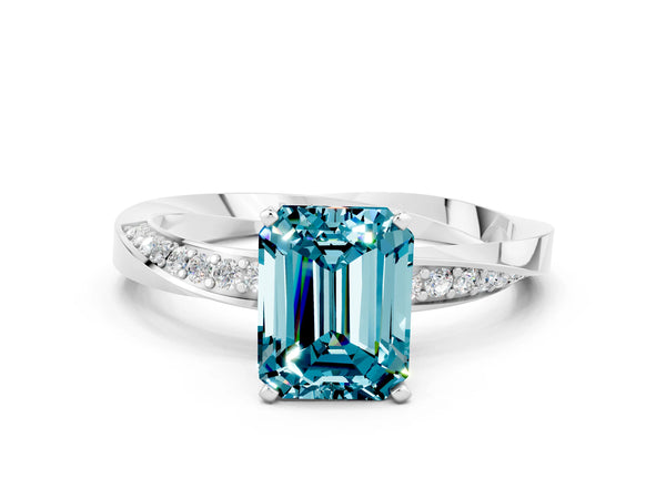 Platinum Emerald Cut Blue Topaz Engagement Ring with Side Stone Accents and Four-Prong Setting
