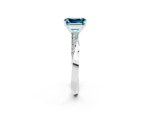 Silver Emerald Cut Blue Topaz Engagement Ring with Side Stone Accents and Four-Prong Setting