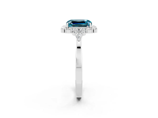 Silver Emerald Cut Blue Topaz Halo Ring with Pear Side Stones and Prong Setting