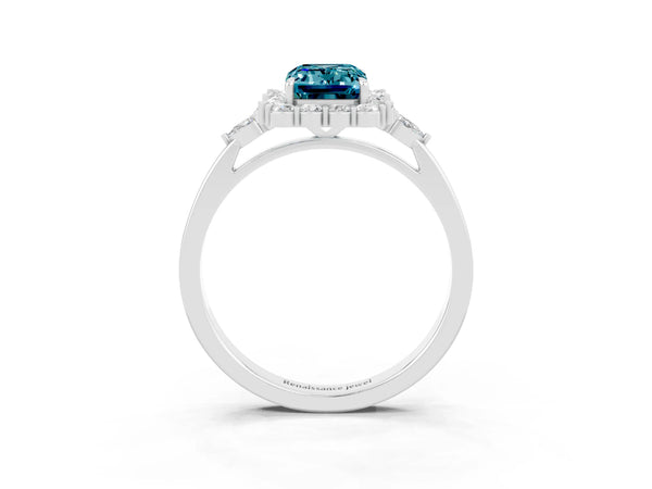 Platinum Emerald Cut Blue Topaz Halo Ring with Pear Side Stones and Prong Setting