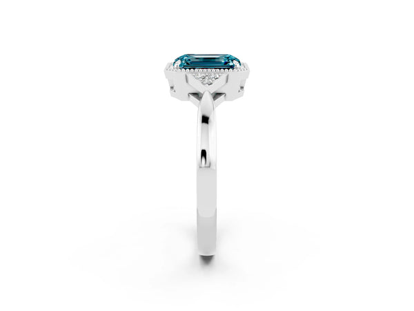 Platinum Emerald Cut Blue Topaz Halo Ring with Tapered Band and Four-Prong Setting