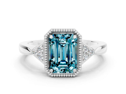 White gold Emerald Cut Blue Topaz Halo Ring with Tapered Band and Four-Prong Setting