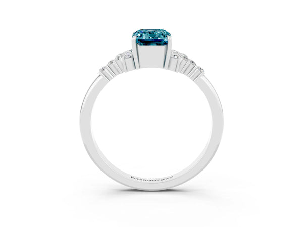 White gold Emerald Cut Blue Topaz Ring with Side Stones and Four-Prong Setting