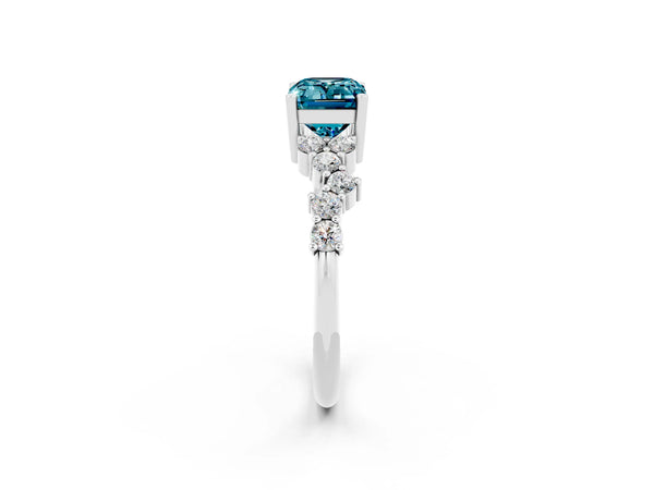 Platinum Emerald Cut Blue Topaz Scattered Round Accent Ring with Prong Setting