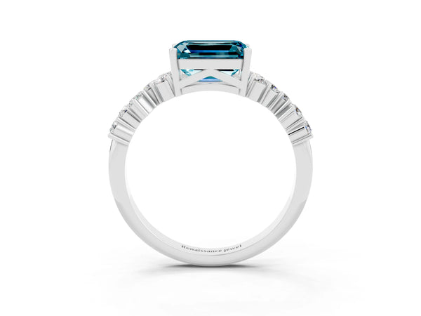 Platinum Emerald Cut Blue Topaz Scattered Round Accent Ring with Prong Setting