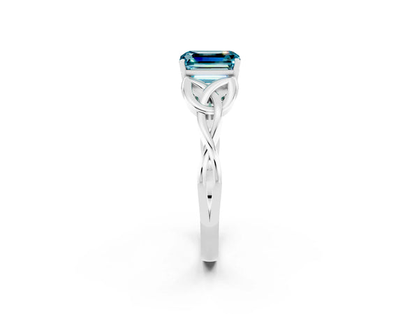 White gold Emerald Cut Blue Topaz Solitaire Engagement Ring with Celtic Knot Band and Four-Prong Setting