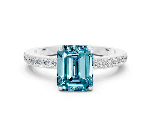 White gold Emerald Cut Blue Topaz Solitaire Engagement Ring with Pavé Band and Four-Prong Setting