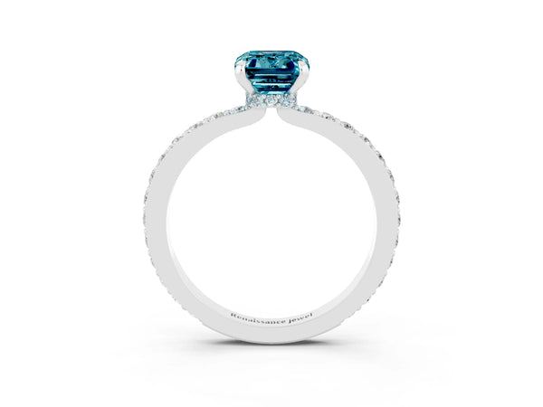 Silver Emerald Cut Blue Topaz Solitaire Engagement Ring with Pavé Band and Four-Prong Setting