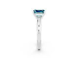 White gold Emerald Cut Blue Topaz Solitaire Engagement Ring with Round Band and Four-Prong Setting_2