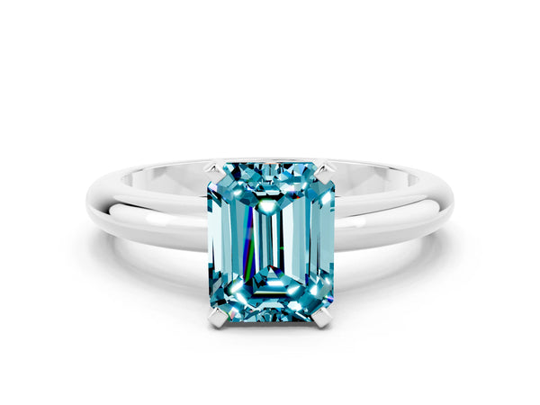 Silver Emerald Cut Blue Topaz Solitaire Engagement Ring with Round Band and Four-Prong Setting