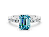 White gold Emerald Cut Blue Topaz Solitaire Pavé Band with Four-Prong Setting