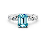 White gold Emerald Cut Blue Topaz Solitaire Pavé Engagement Ring with Round Band and Prong Setting_12