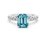 White gold Emerald Cut Blue Topaz Solitaire Pavé Engagement Ring with Round Band and Prong Setting_66