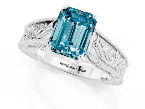 White gold Emerald Cut Blue Topaz Solitaire Ring with Engraved Band and Four-Prong Setting_1