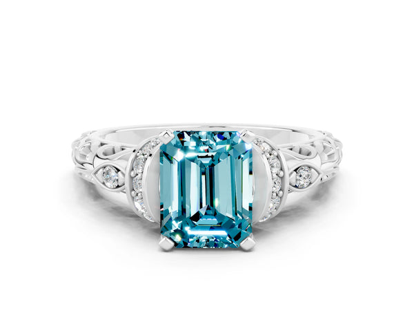 White gold Emerald Cut Blue Topaz Solitaire Ring with Filigree Band and Four-Prong Setting