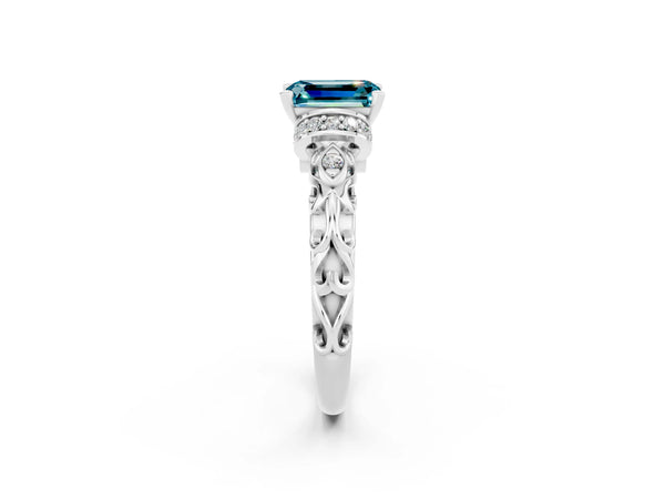 Platinum Emerald Cut Blue Topaz Solitaire Ring with Filigree Band and Four-Prong Setting