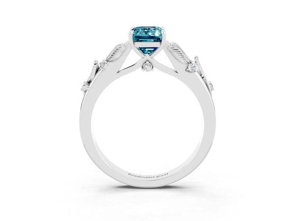 Silver Emerald Cut Blue Topaz Solitaire Ring with Leaf Motif Band and Four-Prong Setting