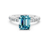 White gold Emerald Cut Blue Topaz Solitaire Ring with Pavé Accents and Four-Prong Setting