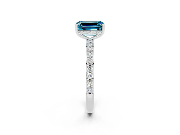 Platinum Emerald Cut Blue Topaz Solitaire Ring with Pavé Band and Hidden Halo