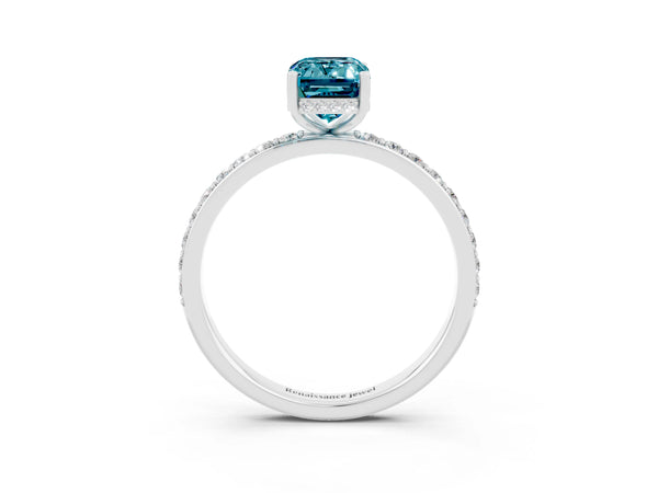 Platinum Emerald Cut Blue Topaz Solitaire Ring with Pavé Band and Hidden Halo