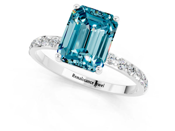 Silver Emerald Cut Blue Topaz Solitaire Ring with Round  Pavé Band and Prong Setting