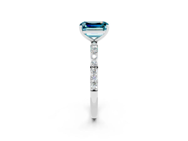 Platinum Emerald Cut Blue Topaz Solitaire Ring with Round  Pavé Band and Prong Setting