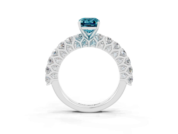 White gold Emerald Cut Blue Topaz Solitaire Ring with Shared Prong Pavé Band and Four-Prong Setting