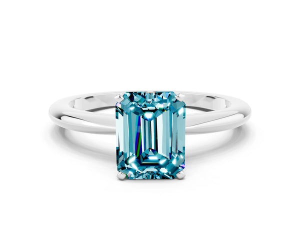 Platinum Emerald Cut Blue Topaz Solitaire Ring with Six-Prong Setting and Classic Band