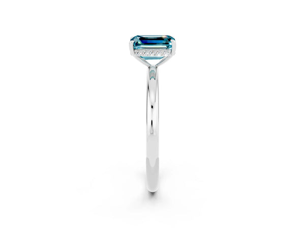 Silver Emerald Cut Blue Topaz Solitaire Ring with Thin Band and Four-Prong Setting