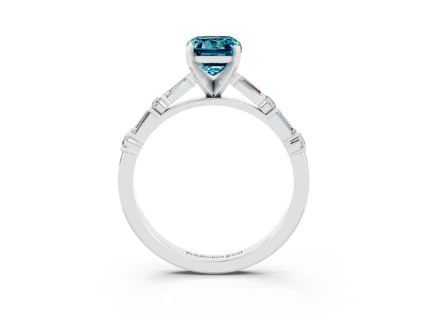 White gold Emerald Cut Blue Topaz Solitaire with Side Baguettes and Channel Set Band
