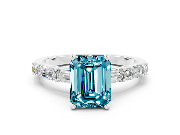 White gold Emerald Cut Blue Topaz Solitaire with Side Baguettes and Channel Set Band