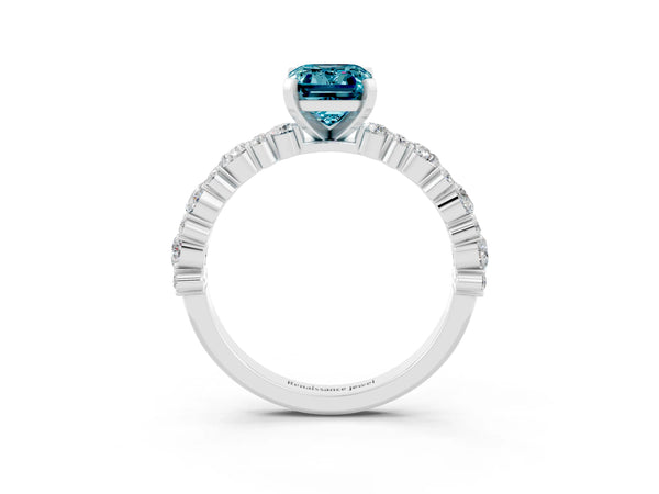 White gold Emerald Cut Blue Topaz Side Stone Solitaire Ring with Round  and Four-Prong Setting