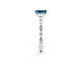 White gold Emerald Cut Blue Topaz Solitaire with Side Stones on a Pavé Band and Four-Prong Setting_2