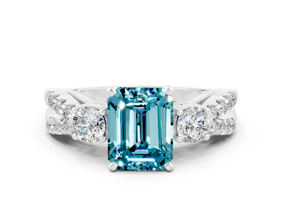 White gold Emerald Cut Blue Topaz Three-Stone Ring with Pavé Split Shank and Four-Prong Setting