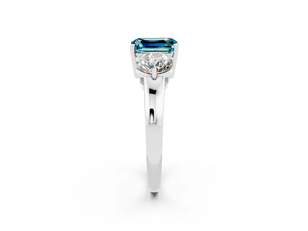 Platinum Emerald Cut Blue Topaz Three-Stone Ring with Prong Setting and Classic Band