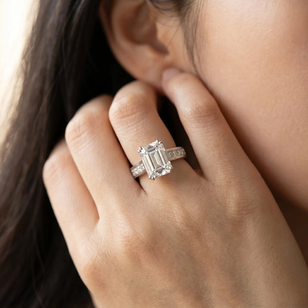White gold Emerald Cut Channel Set Solitaire Engagement Ring with Prong Setting