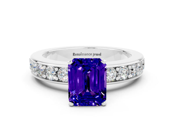 Platinum Emerald Cut Tanzanite Engagement Ring with Channel Set Round  Band and Prong Setting