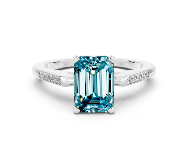 Platinum Emerald Cut Blue Topaz Solitaire Ring with Channel Set Round  Band and Prong Setting