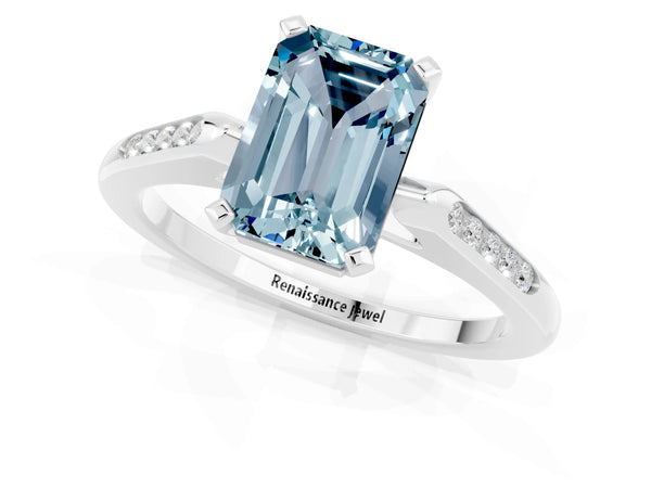 Silver Emerald Cut Aquamarine Solitaire Ring with Channel Set Round  Band and Prong Setting