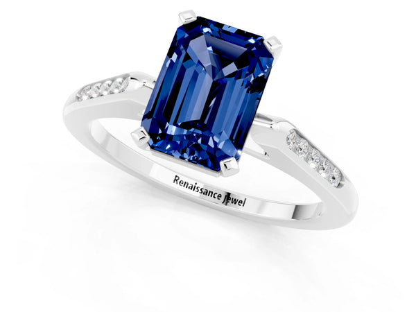 White gold Emerald Cut Blue Sapphire Solitaire Ring with Channel Set Round  Band and Prong Setting