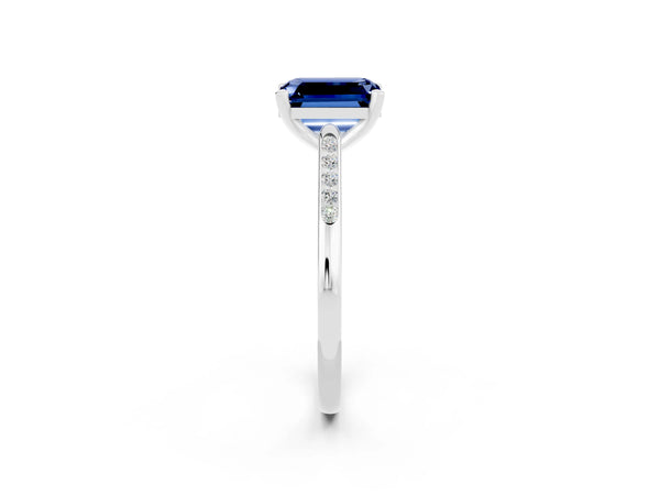 White gold Emerald Cut Blue Sapphire Solitaire Ring with Channel Set Round  Band and Prong Setting