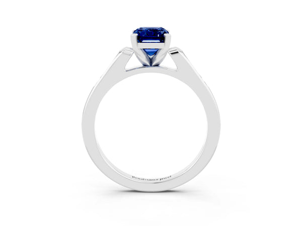 White gold Emerald Cut Blue Sapphire Solitaire Ring with Channel Set Round  Band and Prong Setting