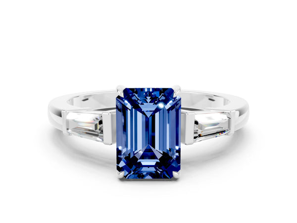 Platinum Emerald Cut Blue Sapphire Three-Stone Ring with Tapered Baguette Side Stones and Prong Setting