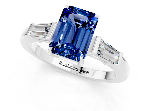 Platinum Emerald Cut Blue Sapphire Three-Stone Ring with Tapered Baguette Side Stones and Prong Setting