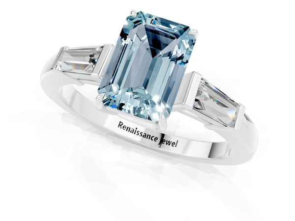 Platinum Emerald Cut Aquamarine Three-Stone Ring with Tapered Baguette Side Stones and Prong Setting